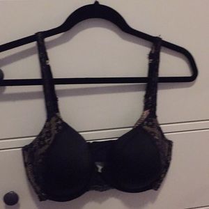 Cream and black bra.